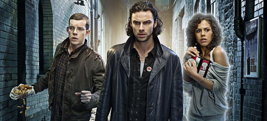 Picture shows: Werewolf George (Russell Tovey), vampire Mitchell (Aidan Turner), and Annie the ghost (Lenora Crichlow) in a narrow alley. George is spilling a package of fish and chips and Annie clutches a box of teabags.