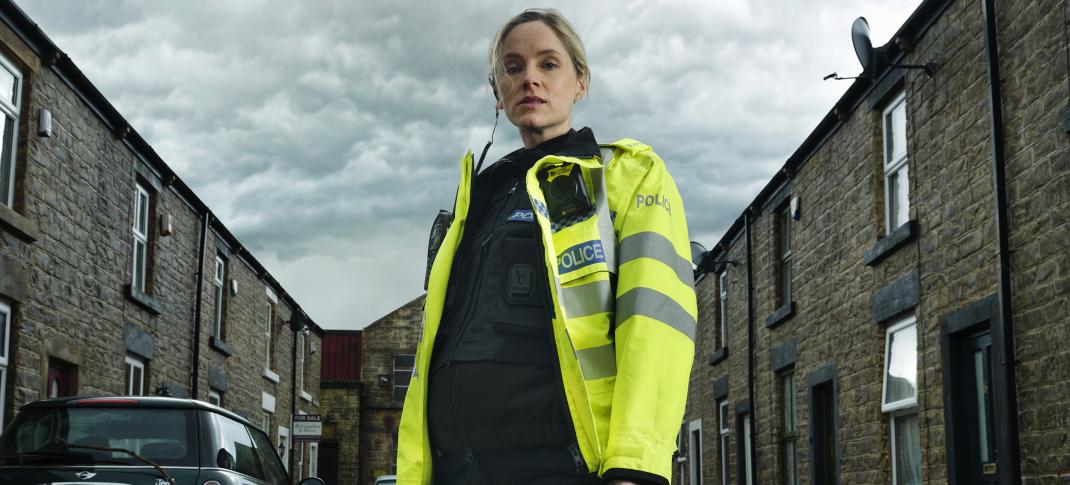Sophie Rundle as PC Joanna Marshall up to her knees in water in 'After the Flood'