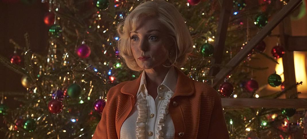 Helen George as Trixie Franklin in front of the Christmas tree in the Call The Midwife Season 13 Holiday Special