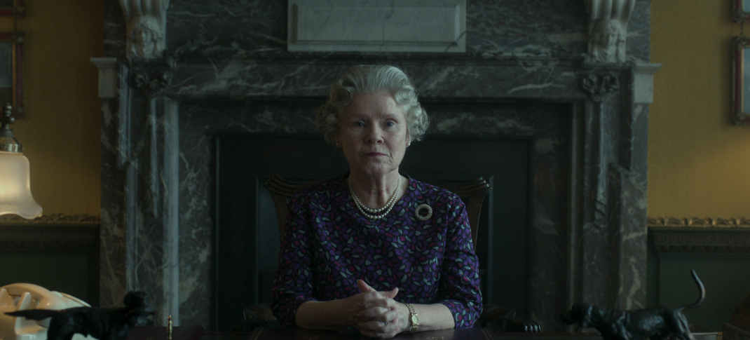 Imelda Staunton as Queen Elizabeth II sits at her desk in The Crown, Season 6, Part 2