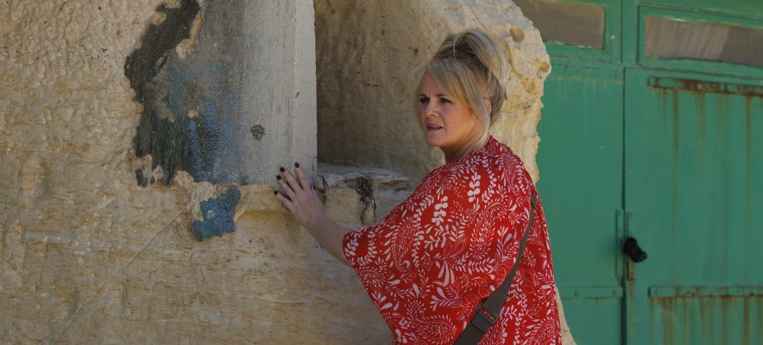 Sally Lindsay as Jean White looking for clues in old ruins in 'The Madame Blanc Mysteries' Season 3