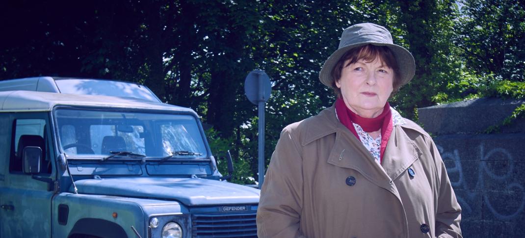 Brenda Blethyn as DCI Vera Stanhope standing in front of her car in 'Vera' Season 13