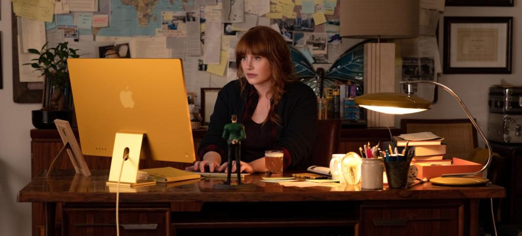 Bryce Dallas Howard typing away at her Apple products as Elly Conway in Apple TV+'s 'Argylle'
