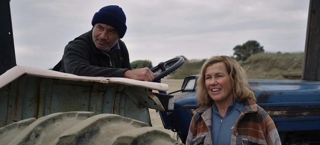 Temuera Morrison as Ed and Robyn Malcolm as Heather on their tractor in Far North