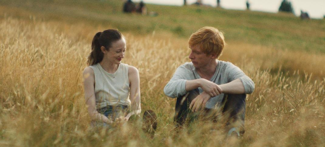 Andrea Riseborough and Domhnall Gleeson as the titular 'Alice & Jack' in a wheat field