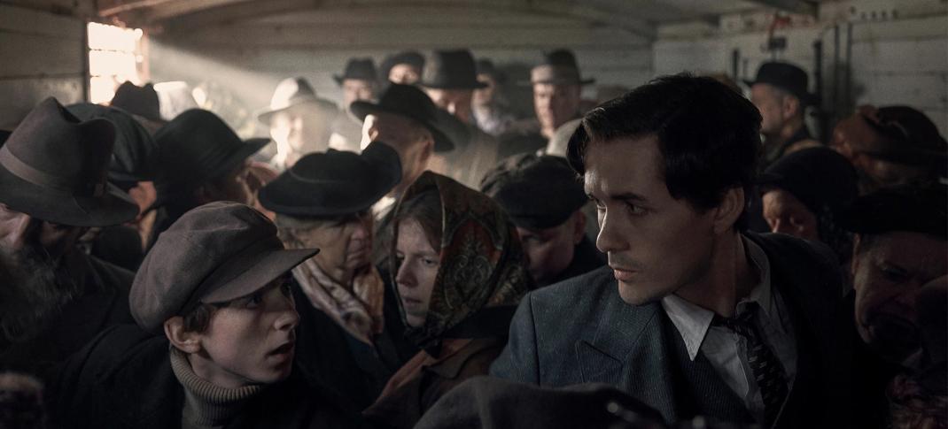 Jonah Hauer King as Lali Sokolov on the train in 'The Tattooist Of Auschwitz' 