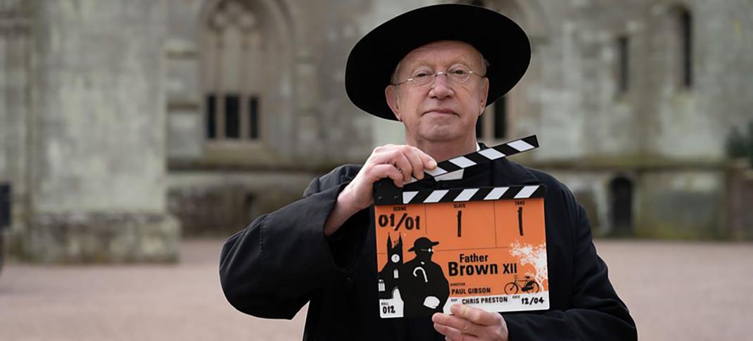 Mark Williams, dressed in his Father Brown outfit, marks the beginning of filming Season 12 with the clapper