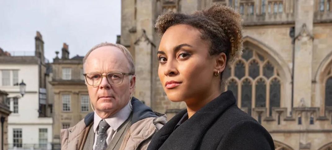 Picture shows: Police officers DS Dodds (Jason Watkins), and DCI Lauren McDonald (Tala Gouveia) pose in front of Bath Abbey.