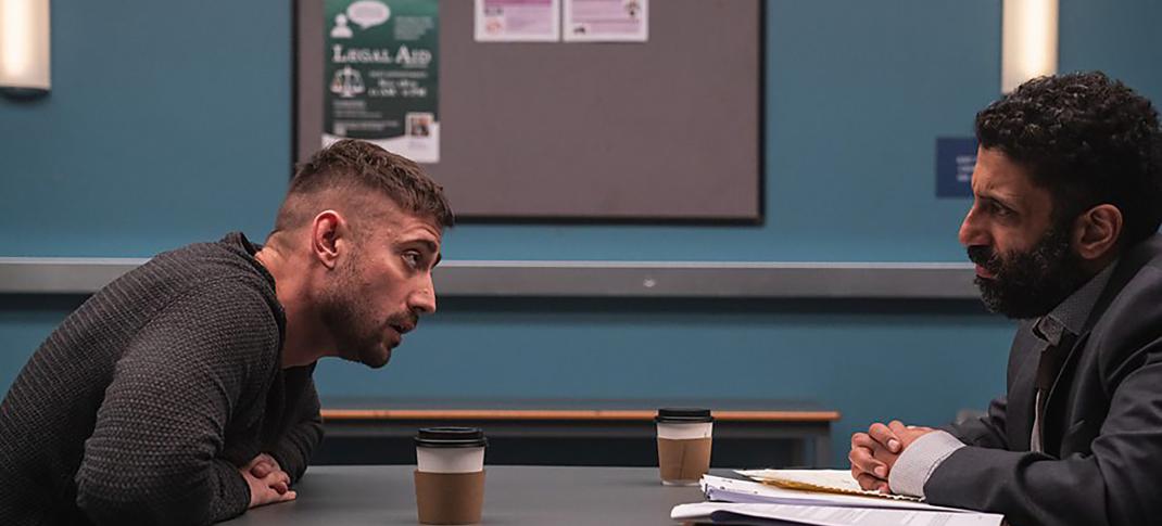 Michael Socha as defendant Justin Mitchell and Adeel Akhtar as his defence solicitor Sam Malik meeting in 'Showtrial' Season 2