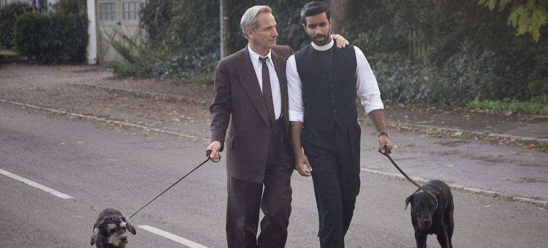 Robson Green as Geordie Keating, Rishi Nair as Alphy Kotteram walking their puppers in 'Grantchester' Season 9