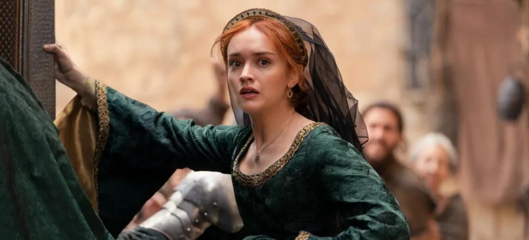 Olivia Cooke as Queen Alicent Hightower flings open a door in a dramatic moment.