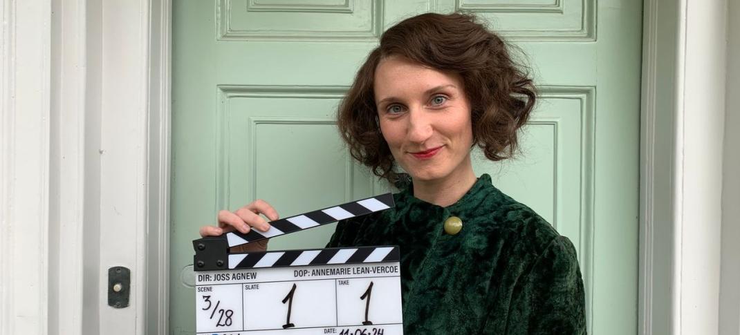 Bessie Carter holds the clapper to mark the start of filming on Outrageous