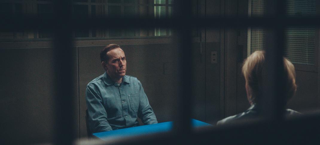 Ben Miller as Professor T receiving a visitor in jail in 'Professor T' Season 3 