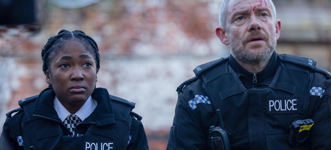 Adelayo Adedayo as Rachel Hargreaves and Martin Freeman as Chris Carson sit together onthe wall in 'The Responder' Season 2