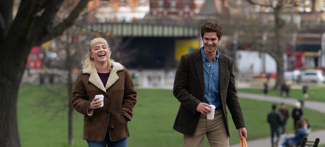 Florence Pugh as Almut and Andrew Garfield as Tobias walk down the sidewalk in 'We Live In Time'