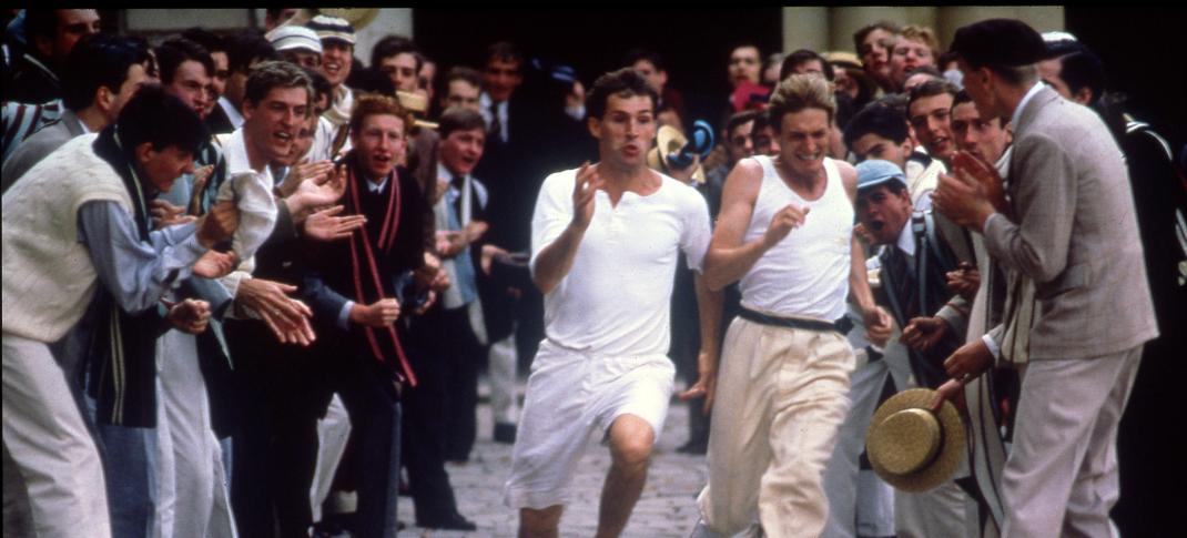 Picture shows: Athletes Harold M. Abrahams (Ben Cross) and Lord Andrew Lindsay (Nigel Havers) in Trinity College's Quad Run, surrounded by an enthusiastic crowd