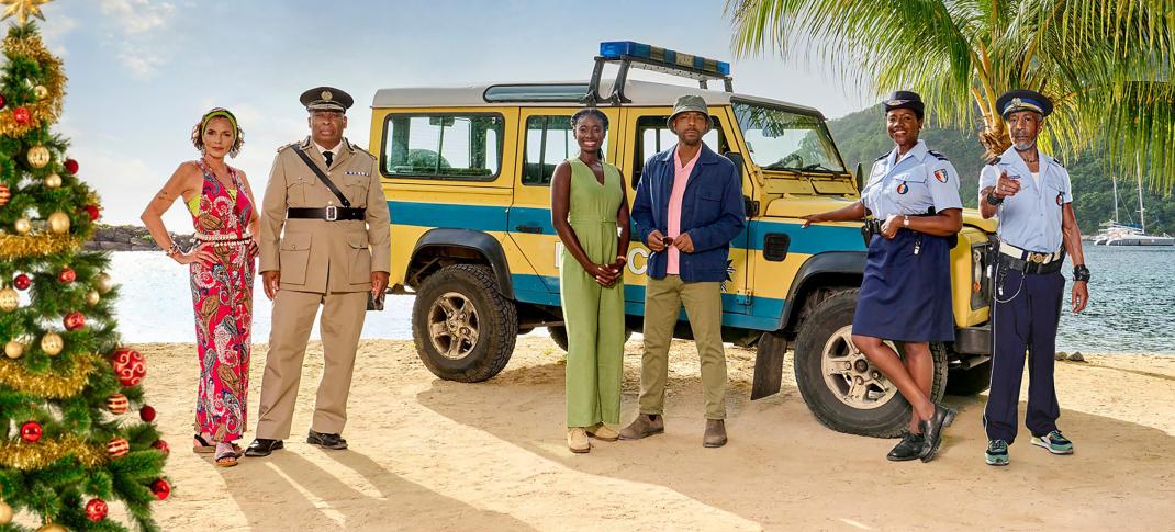 Élizabeth Bourgine as Catherine Bordey, Don Warrington as Commissioner Selwyn Patterson, Shantol Jackson as DS Naomi Thomas, Don Gilet as DI Mervin Wilson, Ginny Holder as Officer Darlene Curtis, and Danny John-Jules as Officer Dwayne Myers in the 'Death in Paradise' 2024 Festive Special