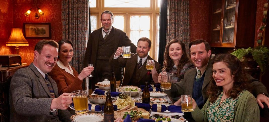 Picture shows: Christmas dinner, L to R, Tristan Farnon (Callum Woodhouse), Audrey Hall (Anna Madeley), Richard Alderson (Tony Pitts), Siegfried Farnon (Samuel West), Jenny Alderson (Imogene Clawson), James Herriot (Nicholas Ralph), and Helen Herriot (Rachel Shenton) raise their glasses in a toast at Christmas dinner