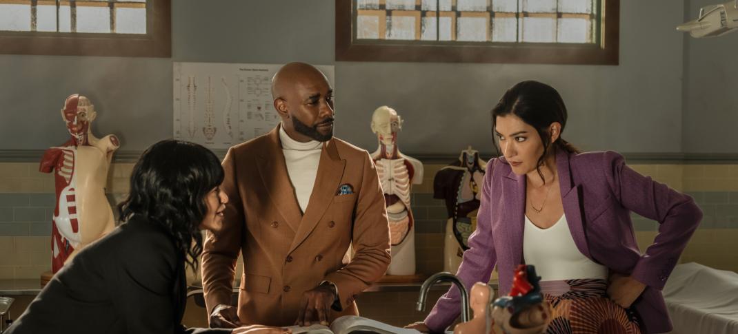 Eve Harlow as Dr. Ingrid Derian, Morris Chestnut as Dr. John Watson, and Inga Schlingmann as Dr. Sasha Lubbock in 'Watson' Season 1