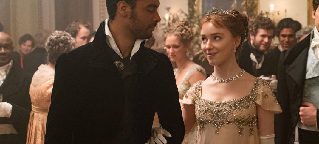 Rege-Jean Page as Simon and Phoebe Dynevor as Daphne taking a turn around the ballroom in 'Bridgerton' Season 1