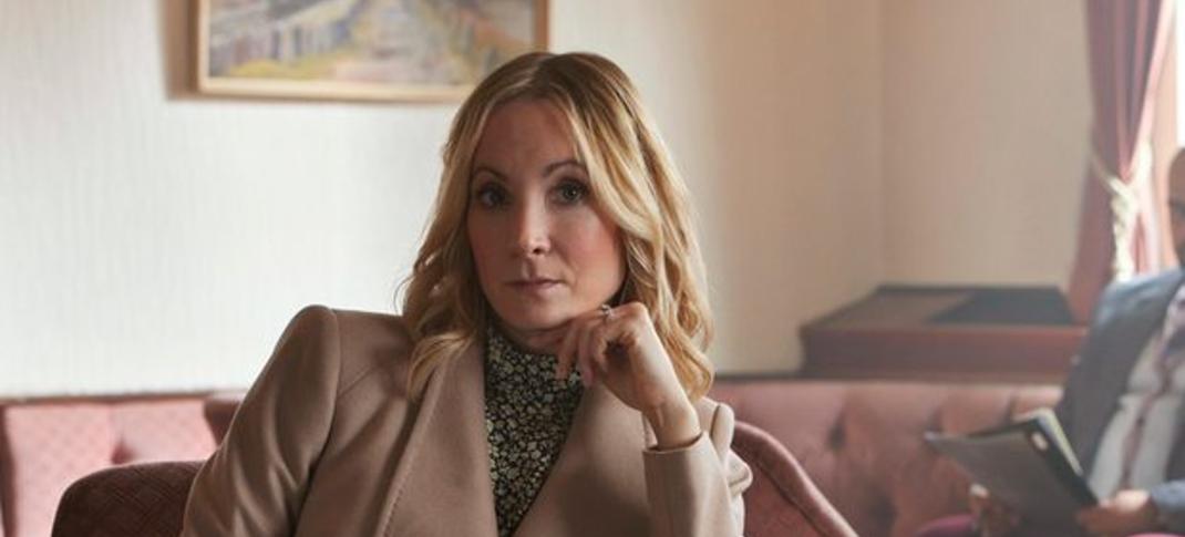 Joanne Froggatt as Sarah, sitting prim and proper-like in her living room in Sherwood