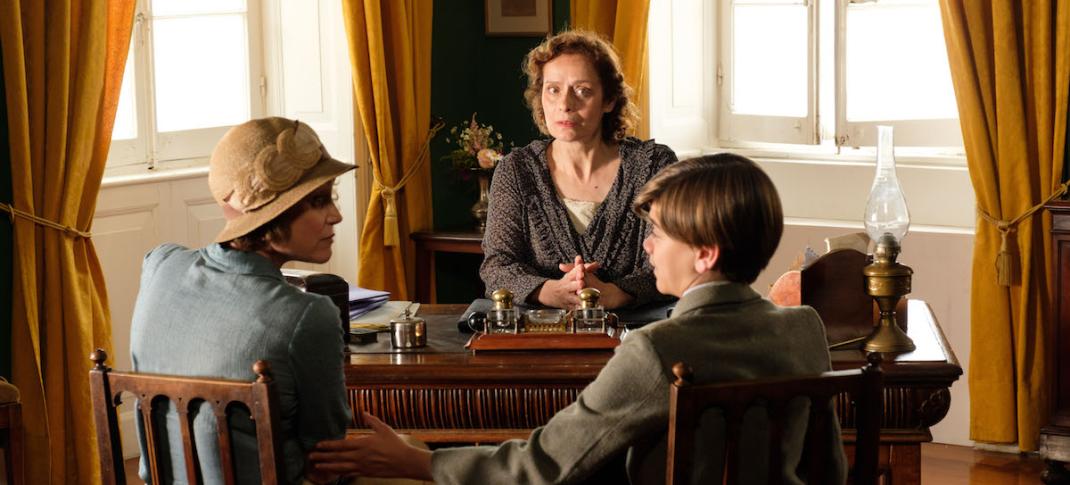 Louisa (Keeley Hawes), Headmistress (Noni Ioannidou) & Gerry (Milo Parker) (Photo Credit: Courtesy of Joss Barratt for Sid Gentle Films & MASTERPIECE)