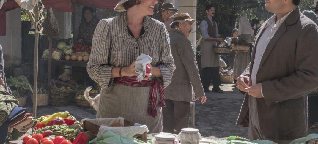Friendly banter at the market between Louisa (Keeley Hawes) and Spiros (Alexis Georgoulis) Photo: (Courtesy of John Rogers/Sid Gentle Films for ITV and MASTERPIECE)
