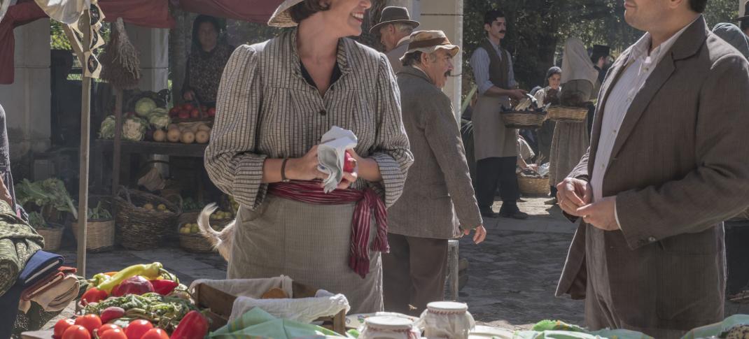 Friendly banter at the market between Louisa (Keeley Hawes) and Spiros (Alexis Georgoulis)  Photo: (Courtesy of John Rogers/Sid Gentle Films for ITV and MASTERPIECE)