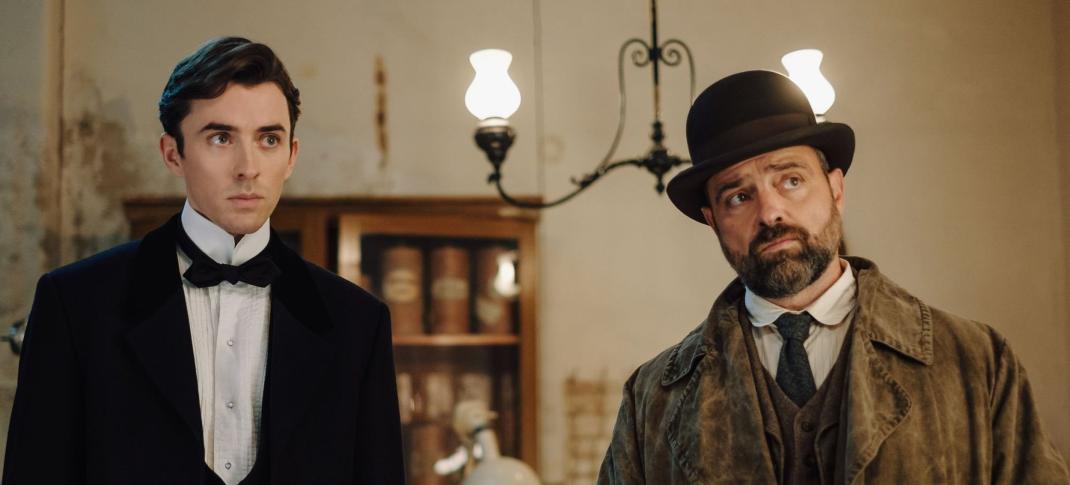 Picture shows: Matthew Beard as Max Liebermann Juergen Maurer as Oskar Reinhardt in a drawing room in Vienna Blood Season 2