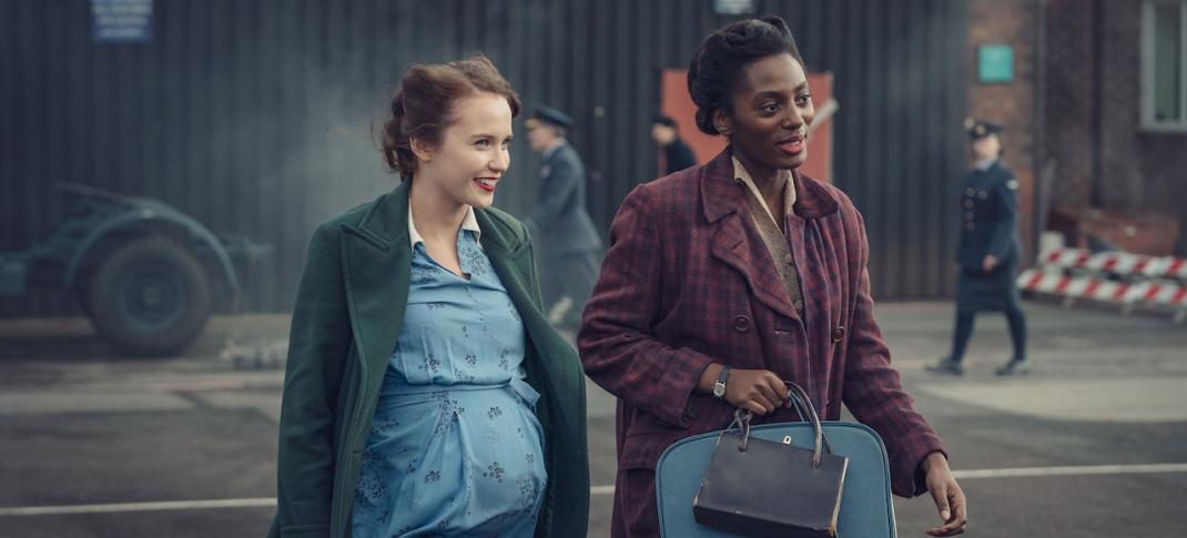 Julia Brown as Lois Bennett and Yrsa Daley-Ward as Connie Knight walk through the RAF base in 'World on Fire' Season 1