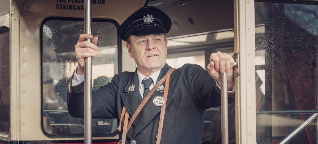 Sean Bean as Douglas Bennett a trolly conductor in World on Fire Season 1